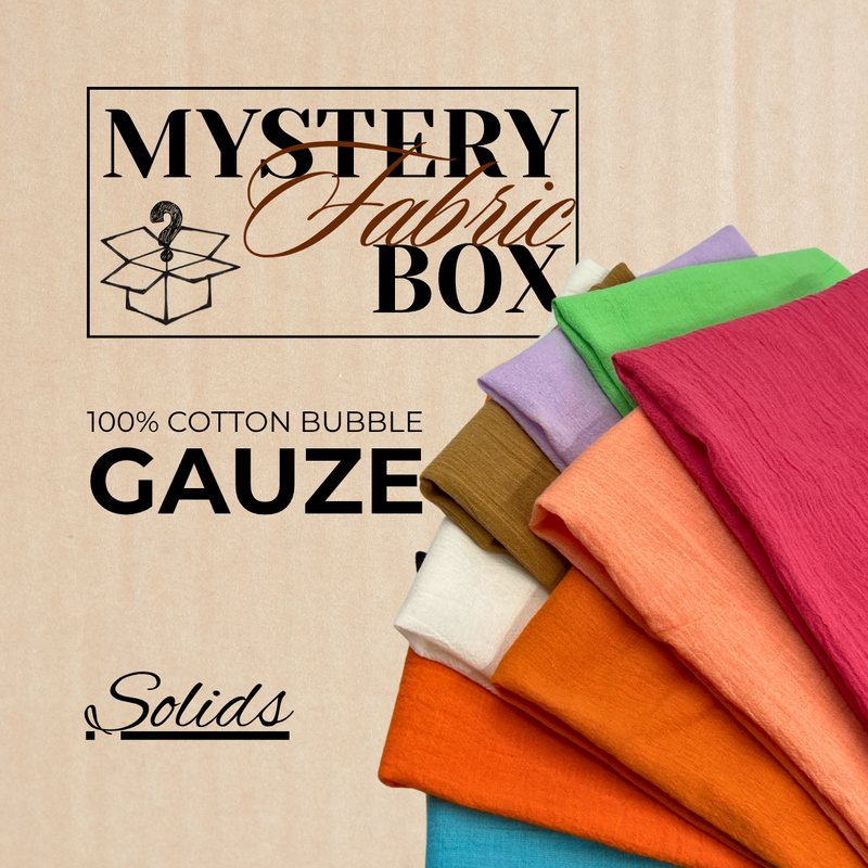 Stack of colorful 100% cotton bubble gauze solids with 'Mystery Fabric Box' text on a beige background.