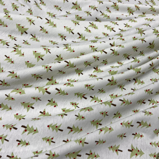 Cotton rib knit featuring small format design of simple Christmas trees. 