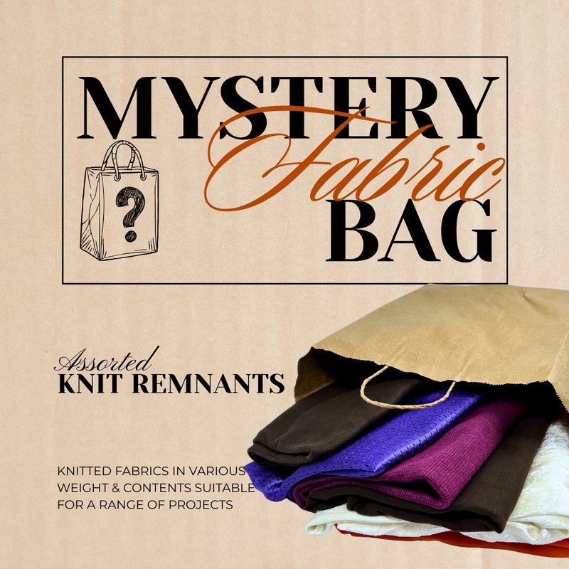 Promotional image for a mystery fabric bag with knit remnants, featuring text and a visual of a fabric bag with colorful fabrics spilling out.