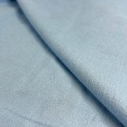 Close-up of light blue fabric with a subtle texture