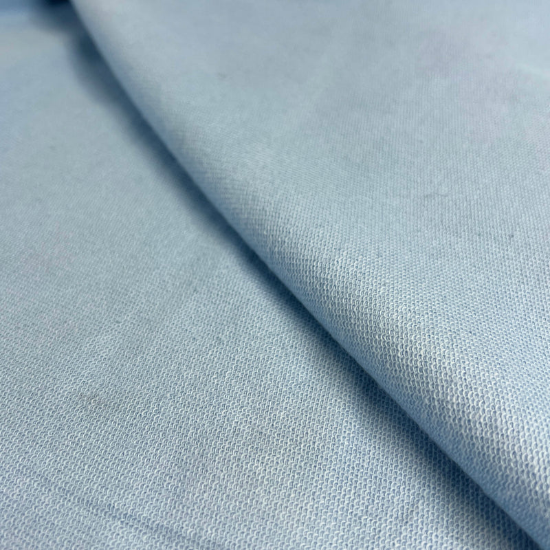 Close-up of light blue fabric with a subtle texture