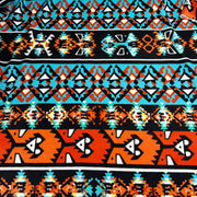 Patterned fabric with geometric design in orange, blue, and black.