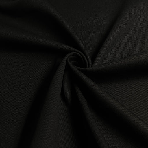 Black medium weight bull denim pulled into a swirl to show off softness and drape