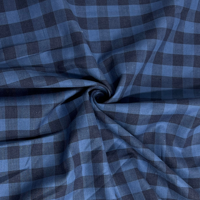 Blue and gray checkered fabric with a swirl pattern