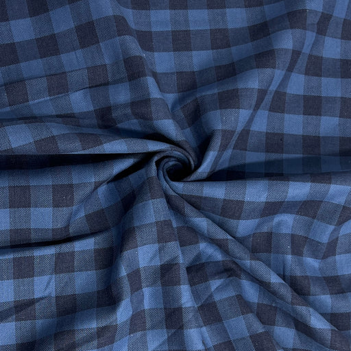 Blue and gray checkered fabric with a swirl pattern