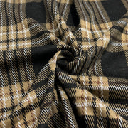 Plaid fabric with black, beige, and white pattern