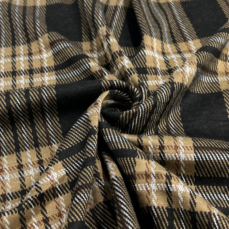 Plaid fabric with black, beige, and white pattern