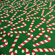 Pattern of candy canes on a green background