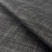 Close-up of dark charcoal grey 100% tencel denim with subtle sheen and a fine twill weave