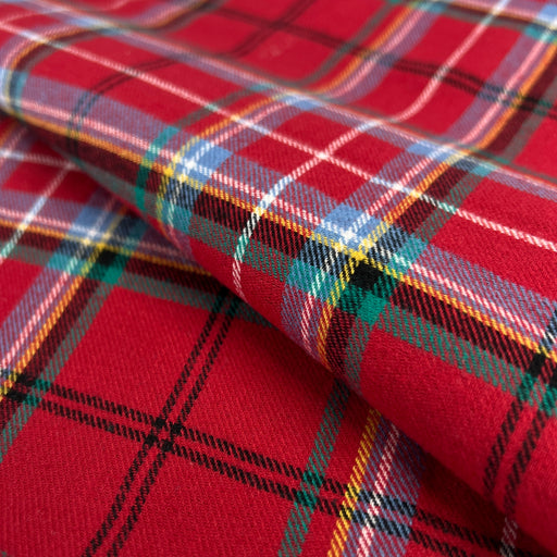 Close-up of red plaid fabric with multicolor lines