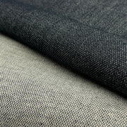 Closeup of dark indigo broken twill weave denim contrasting the face against the reverse, emphasizing the weave pattern