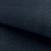 Close-up of dark blue denim fabric with a subtle texture.