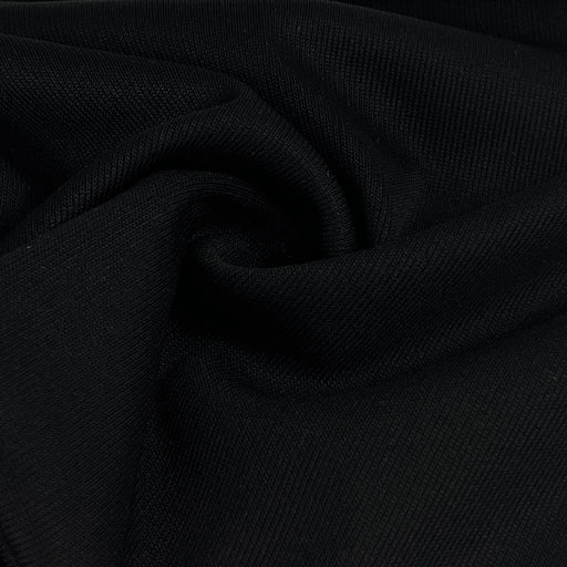 Close-up of black fabric with a textured pattern