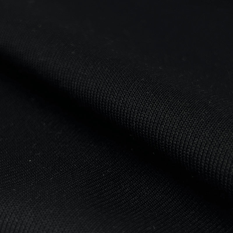 Closeup of black polyester and spandex rib knit fabric sold by the yard