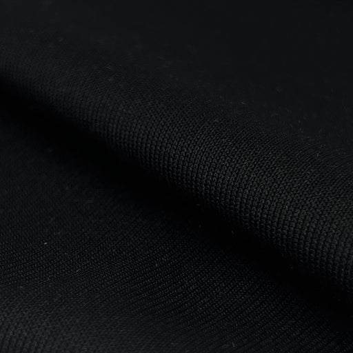 Closeup of black polyester and spandex rib knit fabric sold by the yard