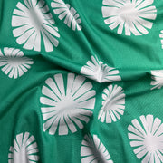 Green fabric with white floral patterns