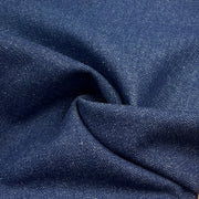 Close-up of dark blue denim fabric with visible texture