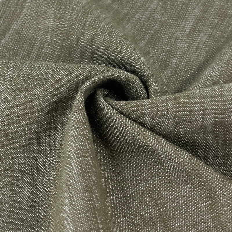Closeup of earthy olive green super stretchy denim