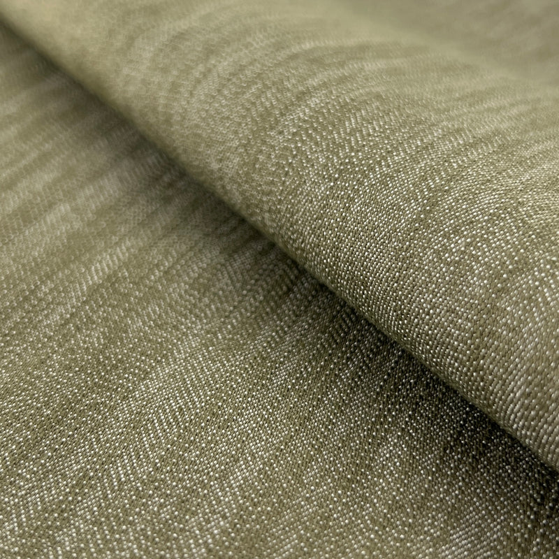 Closeup of olive green stretch denim with high spandex content