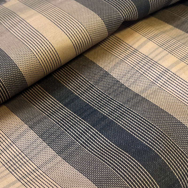 Close-up of striped fabric with black and beige pattern