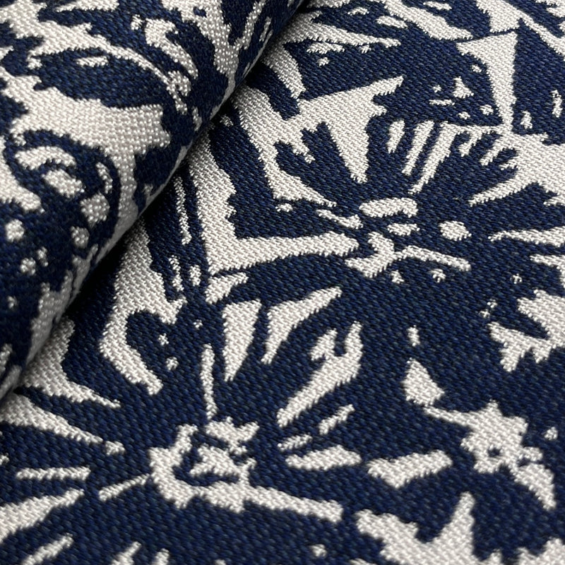 Close-up of fabric with navy and white floral pattern