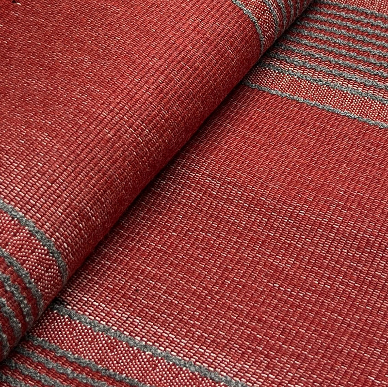 Close-up of red textured fabric with gray stripes