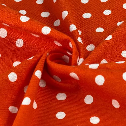 Vibrant Orange and White Polka Dots Printed Jersey Fabric for clothing - cotton/spandex blend