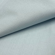 Closeup of a cotton broadcloth fabric in a soft, robin egg blue color