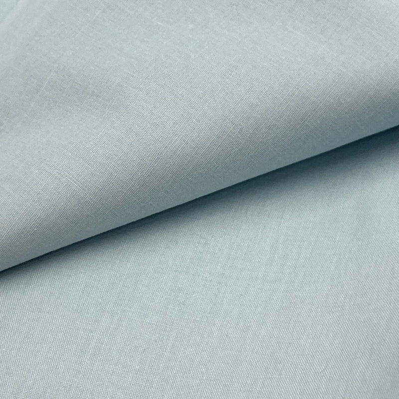 Closeup of a cotton broadcloth fabric in a soft, robin egg blue color