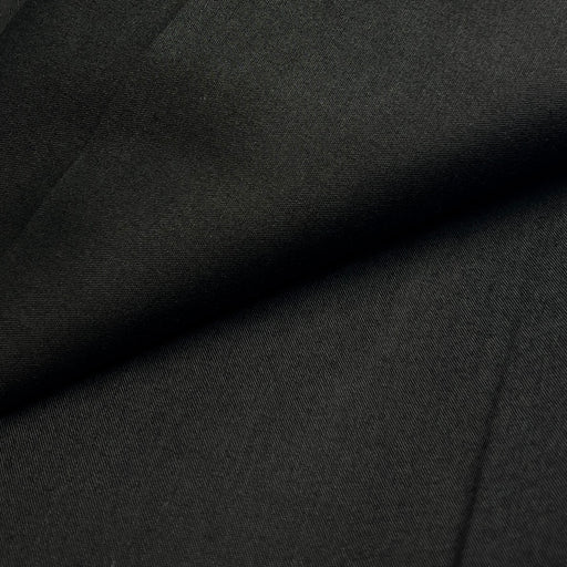 Close-up of dark gray fabric with a subtle texture