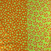 Two patterns side by side on a green background: polka dots and floral shapes.