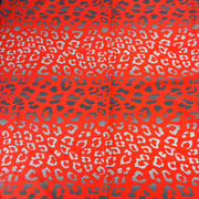 Leopard print pattern on a red background
