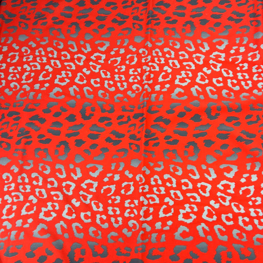 Leopard print pattern on a red background