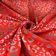 Red fabric with gray leopard print pattern