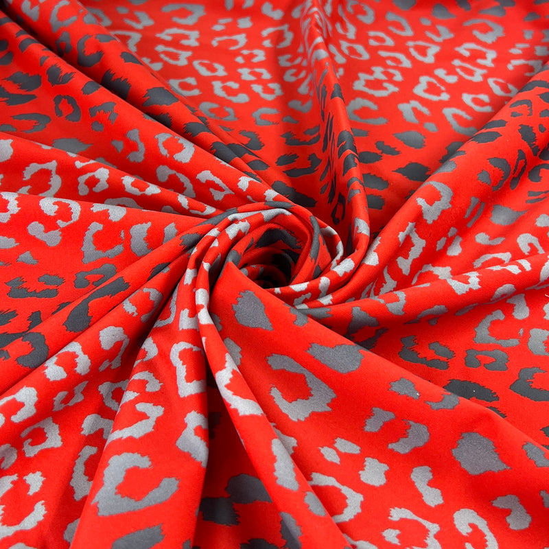 Red fabric with gray leopard print pattern