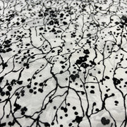 Black and white patterned fabric with abstract design
