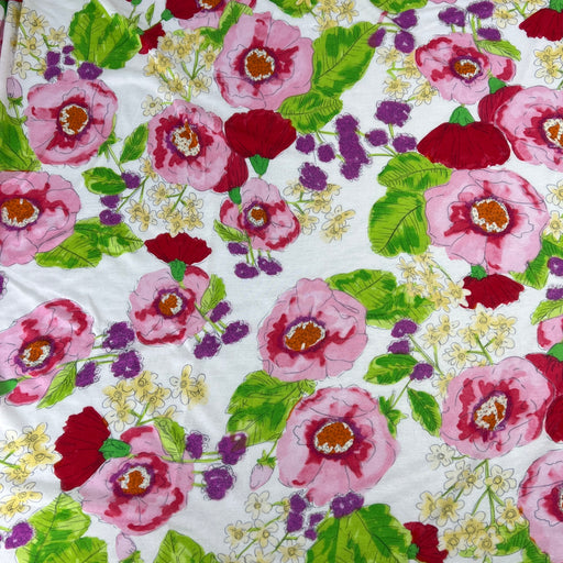 Floral pattern with pink, red, and purple flowers on a white background