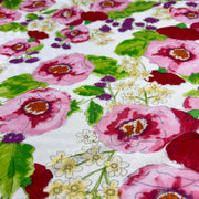 Floral pattern with pink and red flowers on a white background
