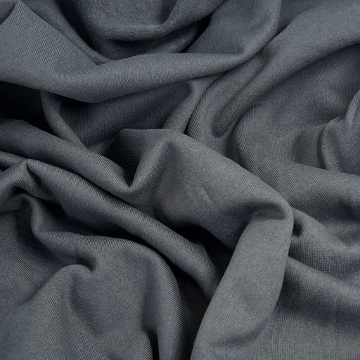 Close-up of dark gray fabric with folds