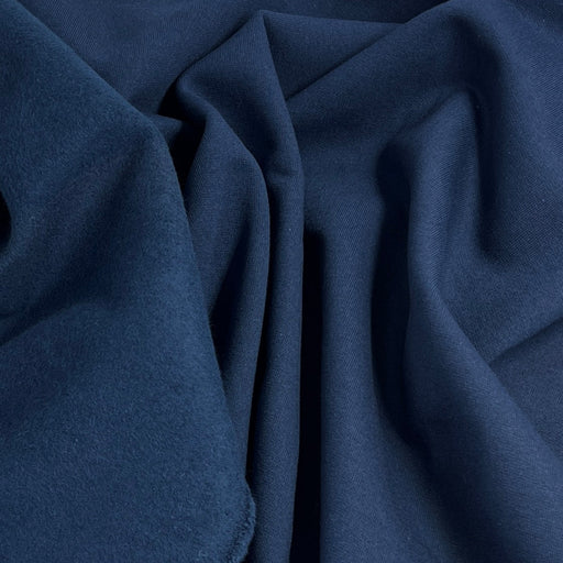 Close-up of dark blue fabric with folds