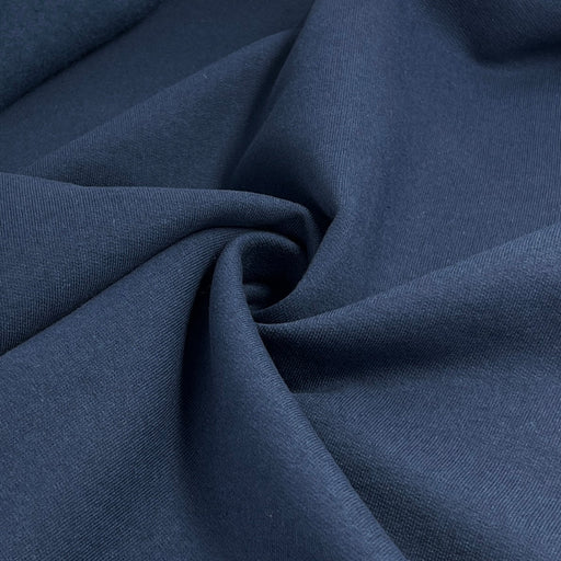 Close-up of dark blue fabric with folds