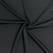 Close-up of black fabric with a swirl pattern