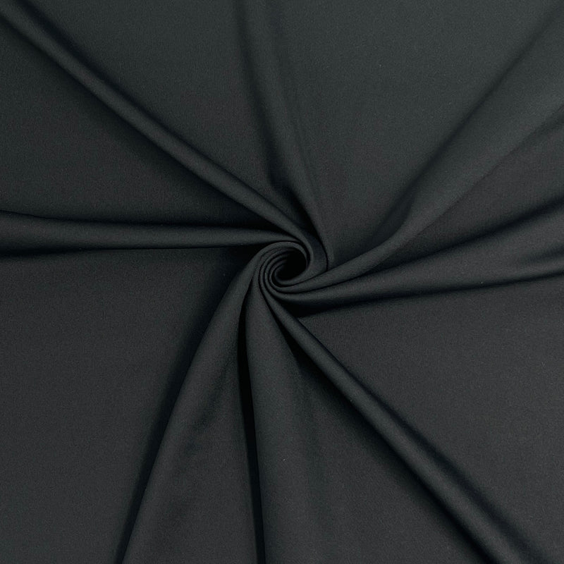 Close-up of black fabric with a swirl pattern