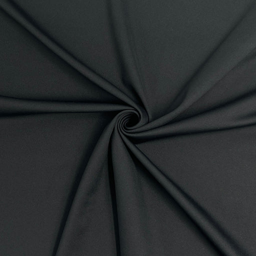 Close-up of black fabric with a swirl pattern