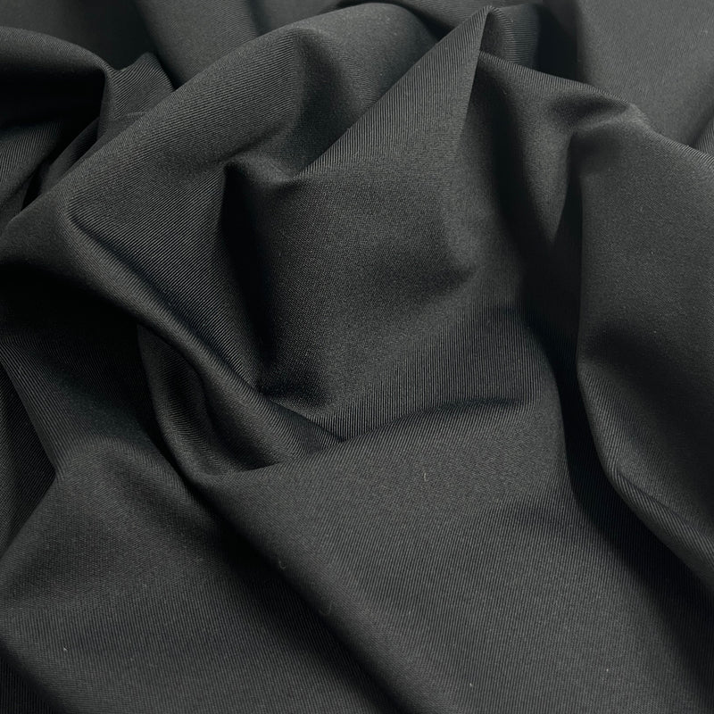 Close-up of dark gray fabric with folds