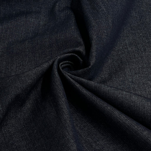 Dark navy blue fabric with a textured twill weave, shown draped in soft folds.
