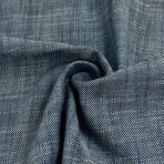Close-up of blue denim fabric with visible texture