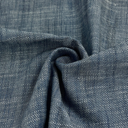 Close-up of blue denim fabric with visible texture