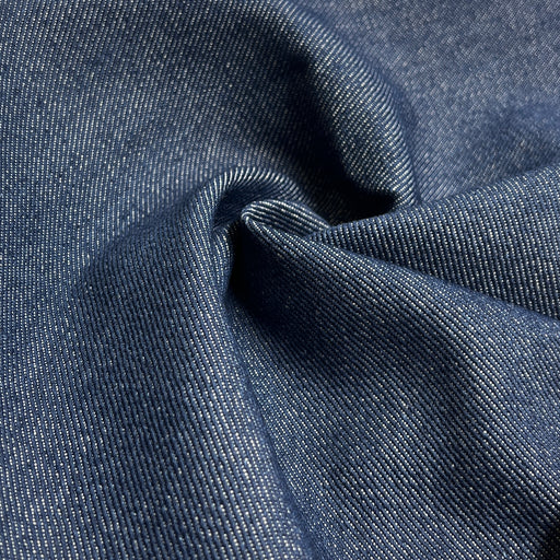 Close-up of blue denim fabric with visible texture