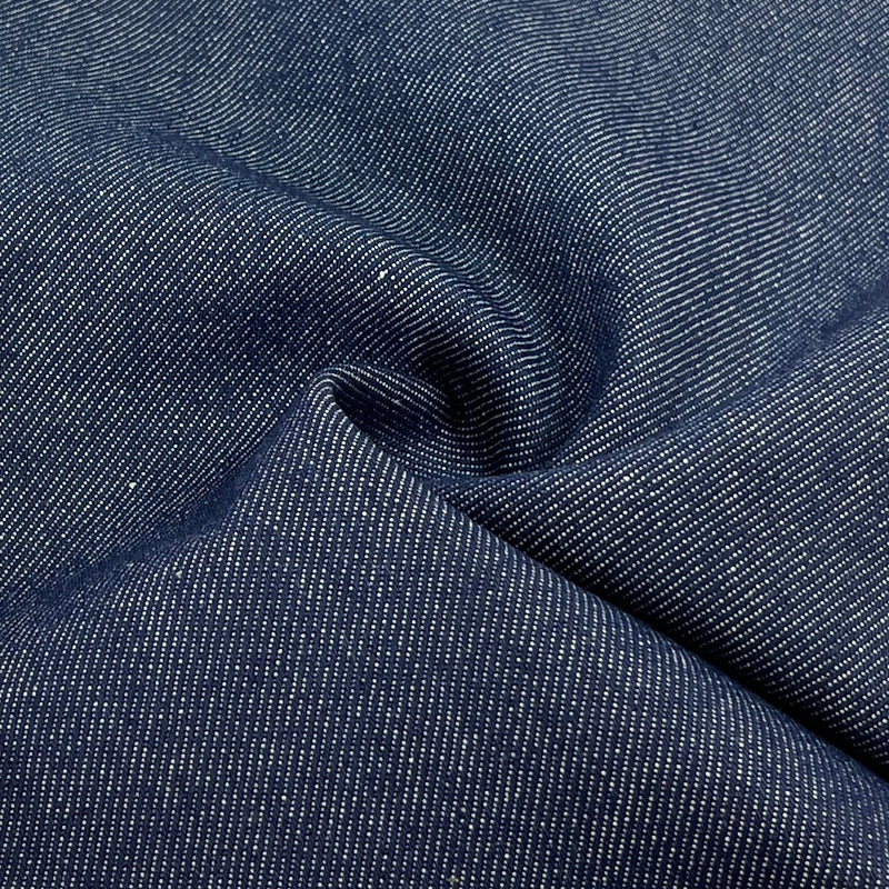Close-up of dark blue denim fabric with visible texture